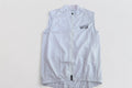 Cycling Out Loud unisex white cycling vest/gilet, worn on model, side view, women's fit