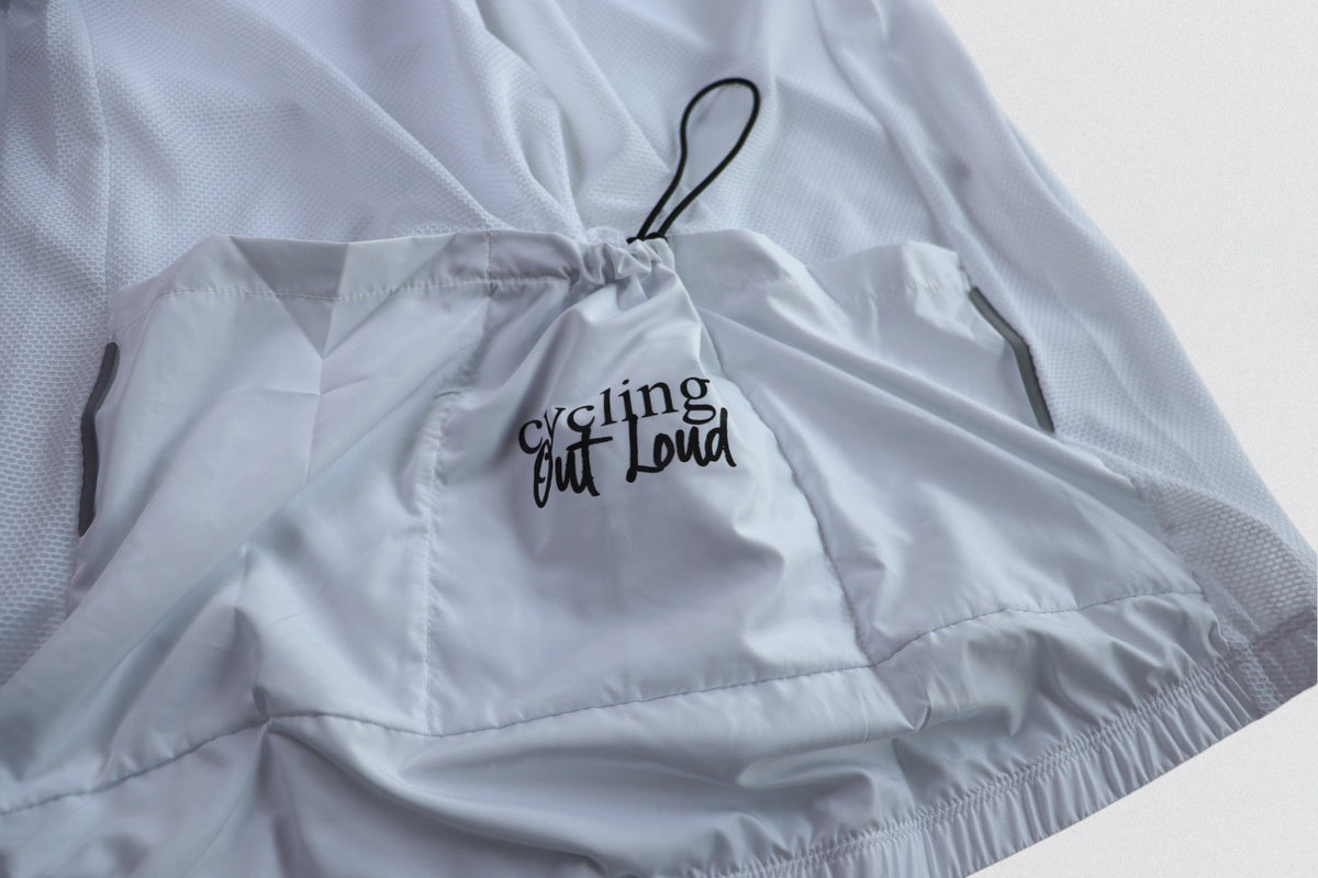 Cycling Out Loud unisex white cycling vest/gilet, worn on model, front angle, women's fit