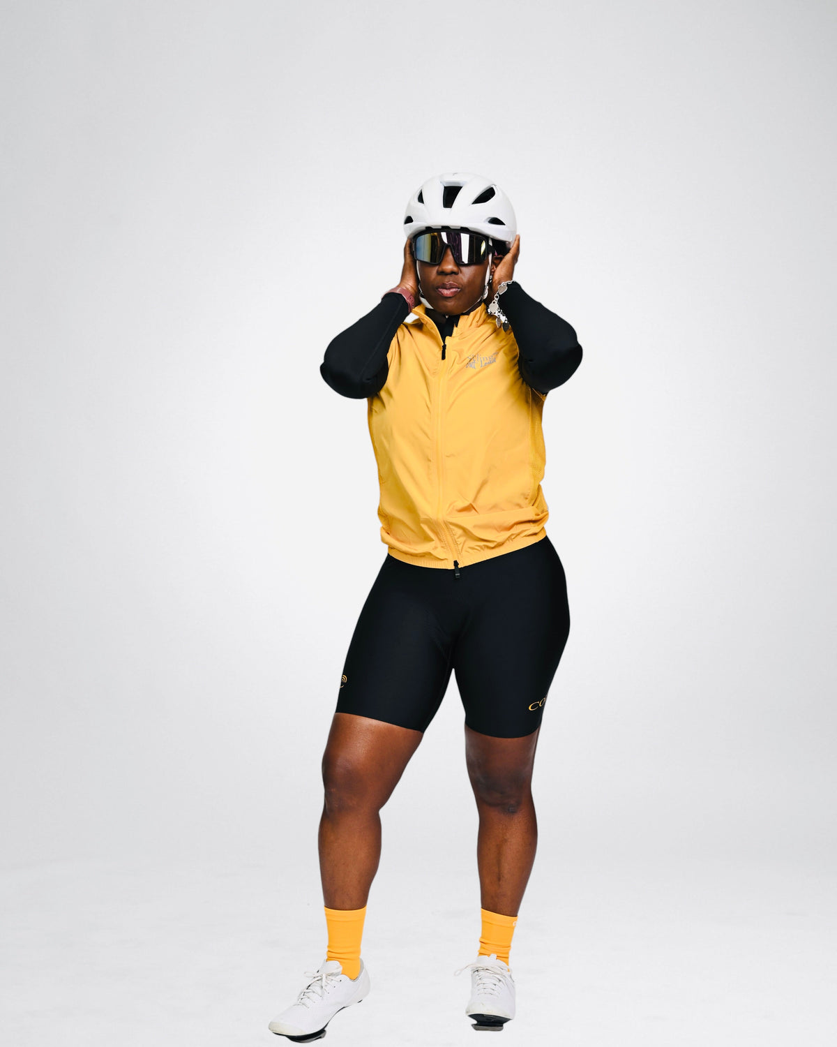Cycling Out Loud unisex gold cycling vest/gilet, back view, women's fit
